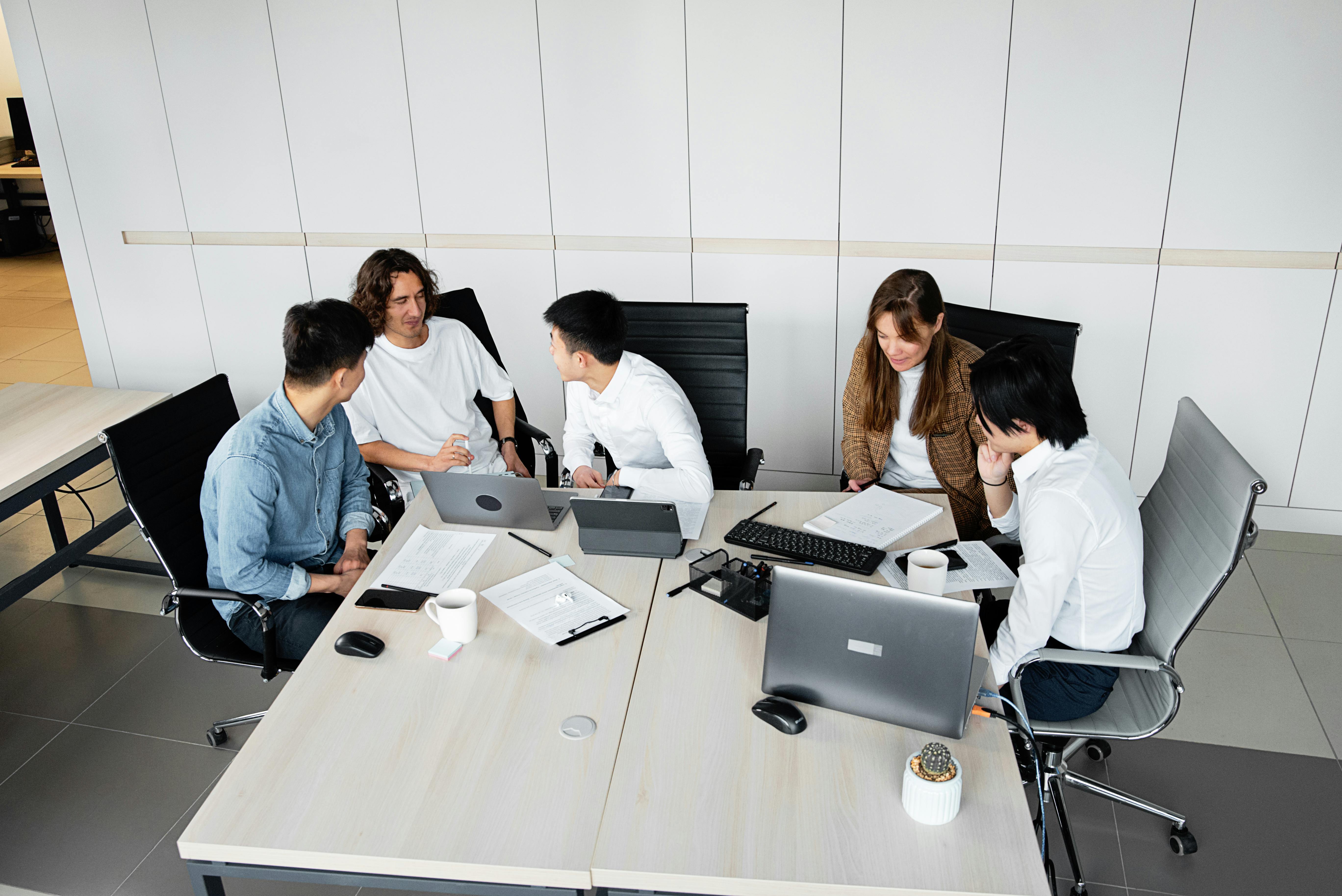 A Stacksync team collaborating around a workspace